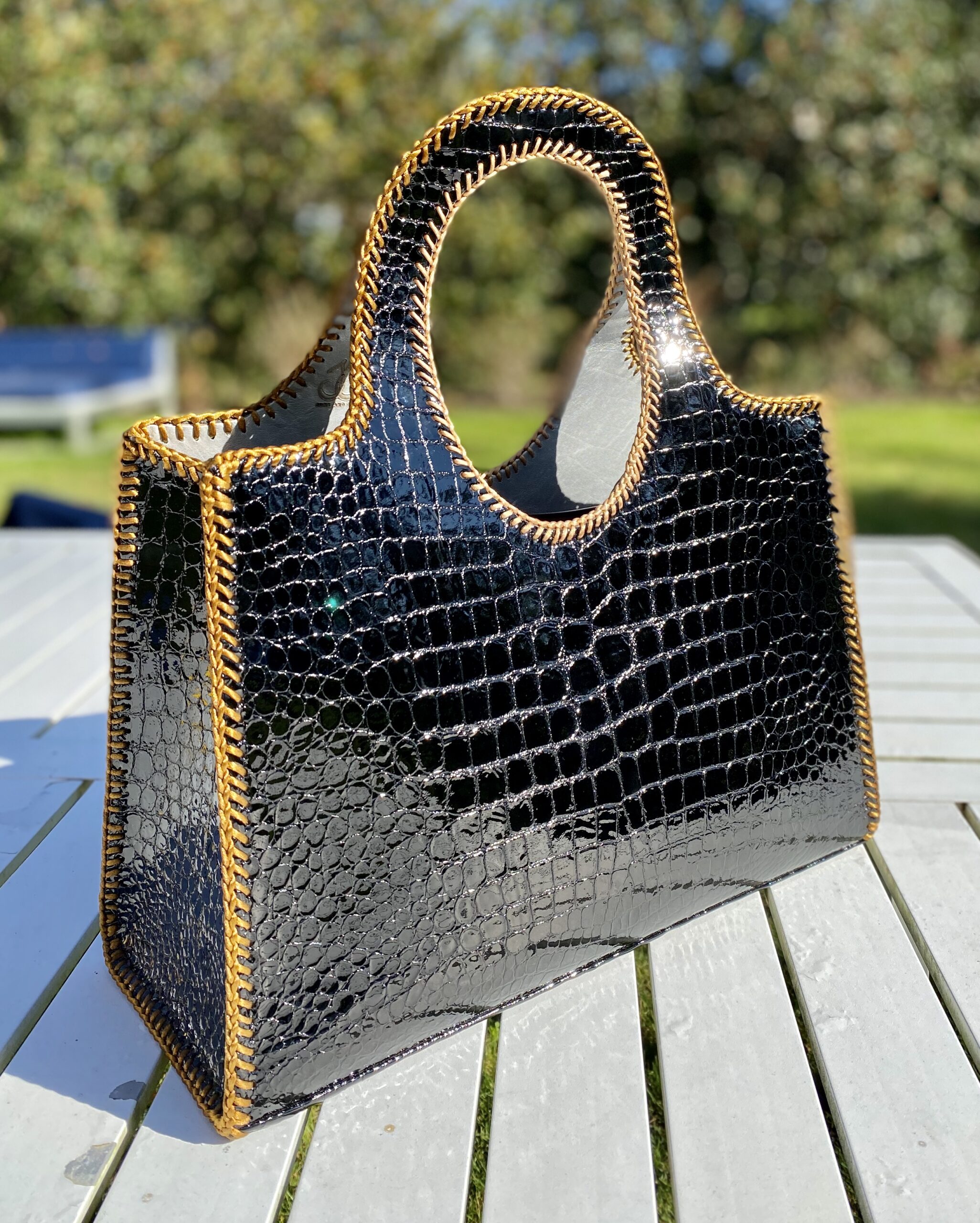 Handmade and handstiched crocodile embossed black with gold stitching  leather bag